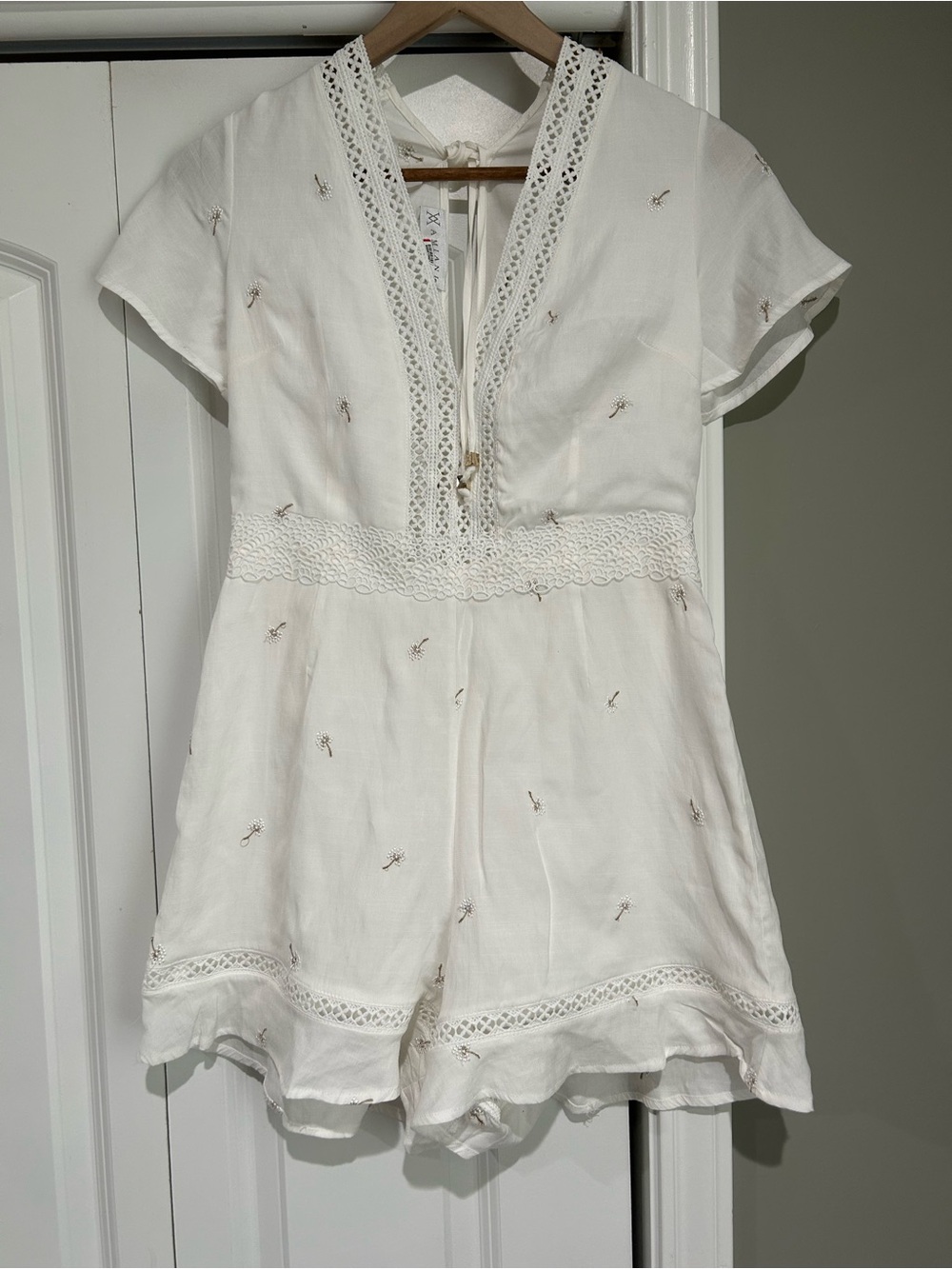 White Crochet-Trim Romper with Delicate Embroidery